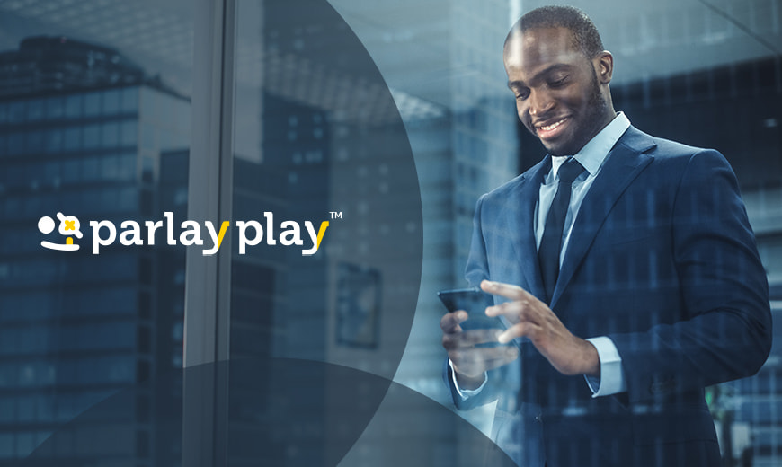 Man holding cellphone and ParlayPlay logo